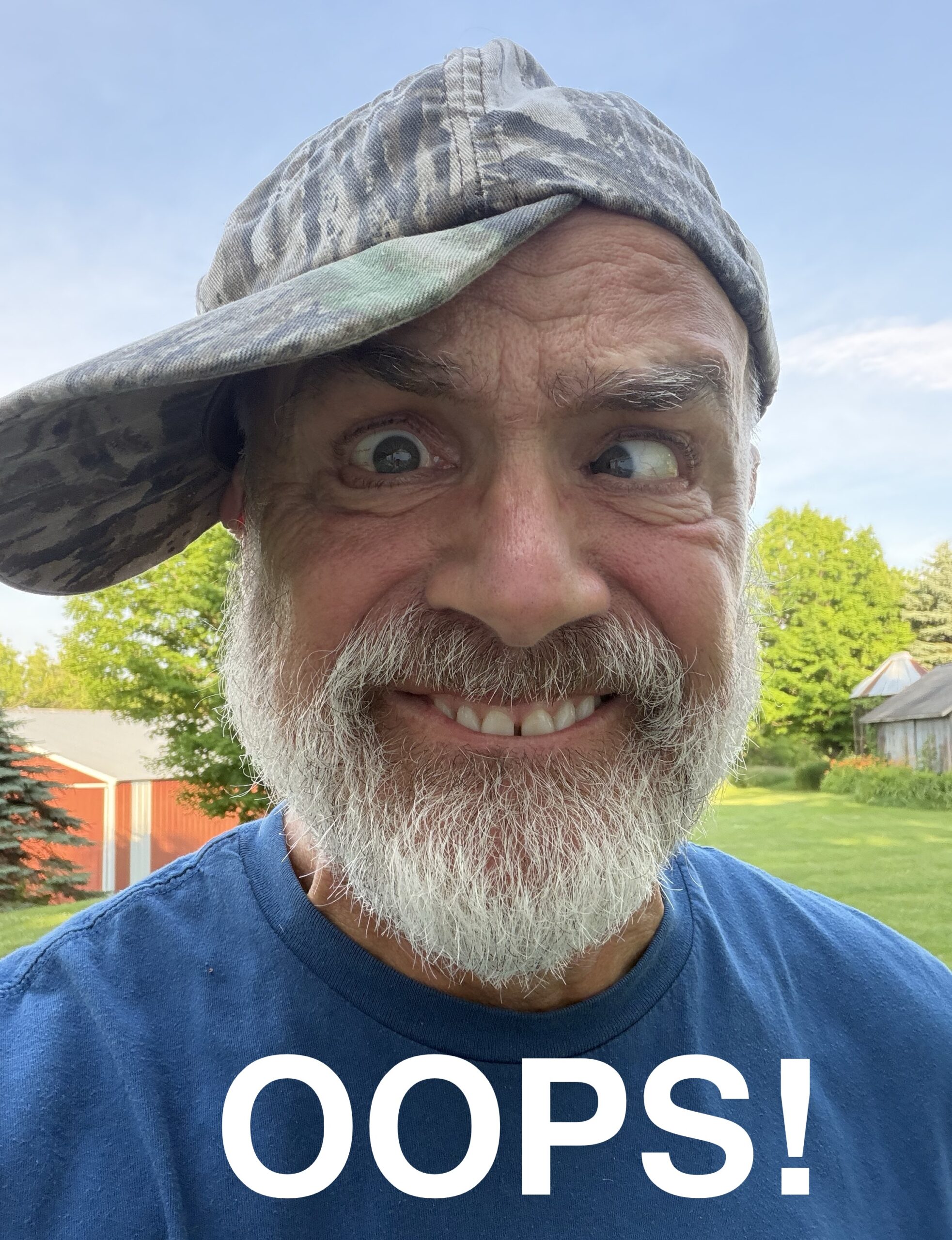 Photo of Mike with his had on sideways, making a funny face, and saying "OOPS!"